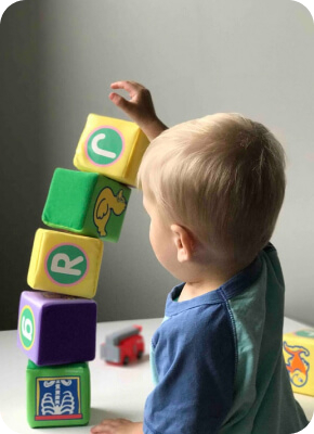 Penguin student building blocks
